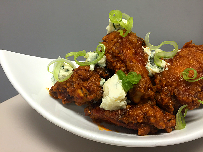 1 Buffalo chicken wings with buttermilk bleu affinee cheese and shaved cel...