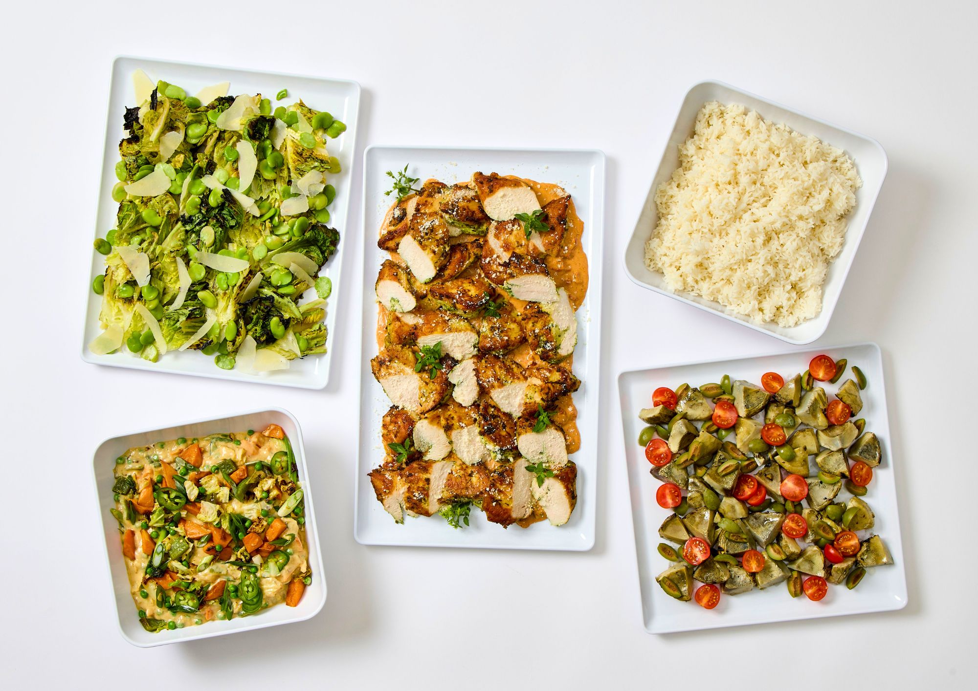 spring dropoff catering menu at paramount events in 2026 featuring spring vegetable curry, grilled chicken with sundried tomato, jasmine rice, grilled artichokes, and charred romaine